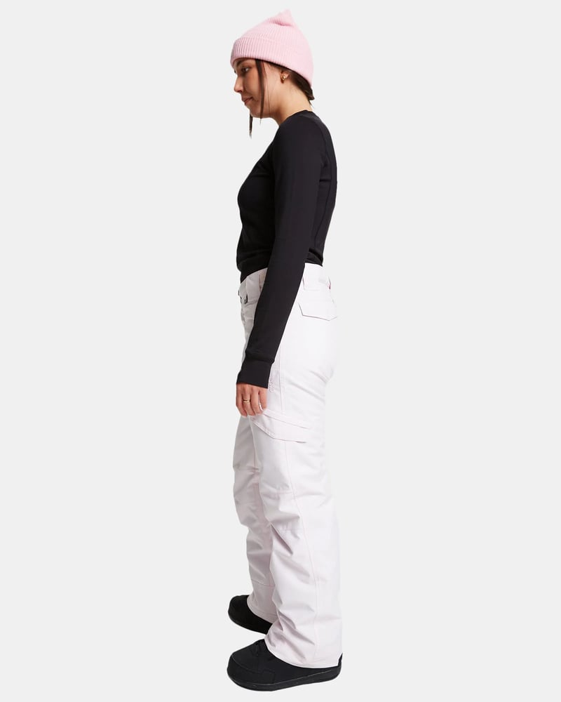 Side view of light pink ROJO Adventure Awaits snow pants with a cargo pocket and relaxed fit.