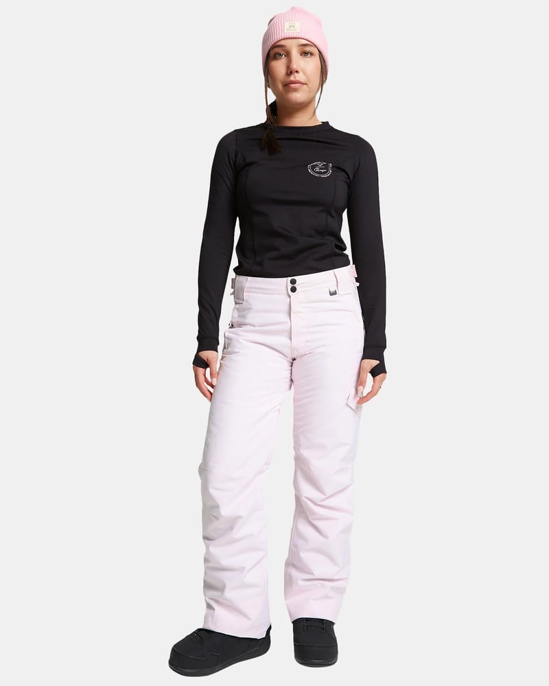 Light pink ROJO Adventure Awaits snow pants with a double-button waist and side pocket, shown on a model.